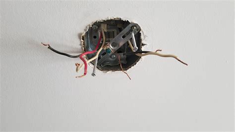 electrical box has 2 black and 2 white wires|2 black wires in ceiling box.